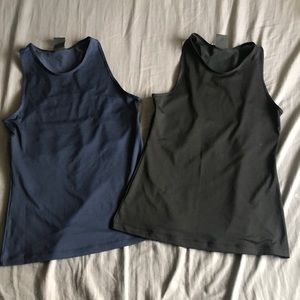 2 black and navy Nike tank tops